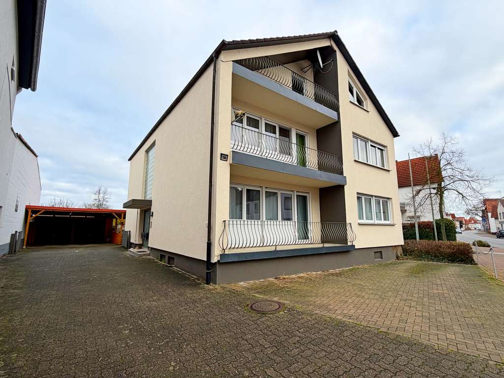 Immobilie in Bellheim - Drei-Familienhaus mit Doppelgarage, Carports und Garten - zur sofortigen Nutzung - Bild 0