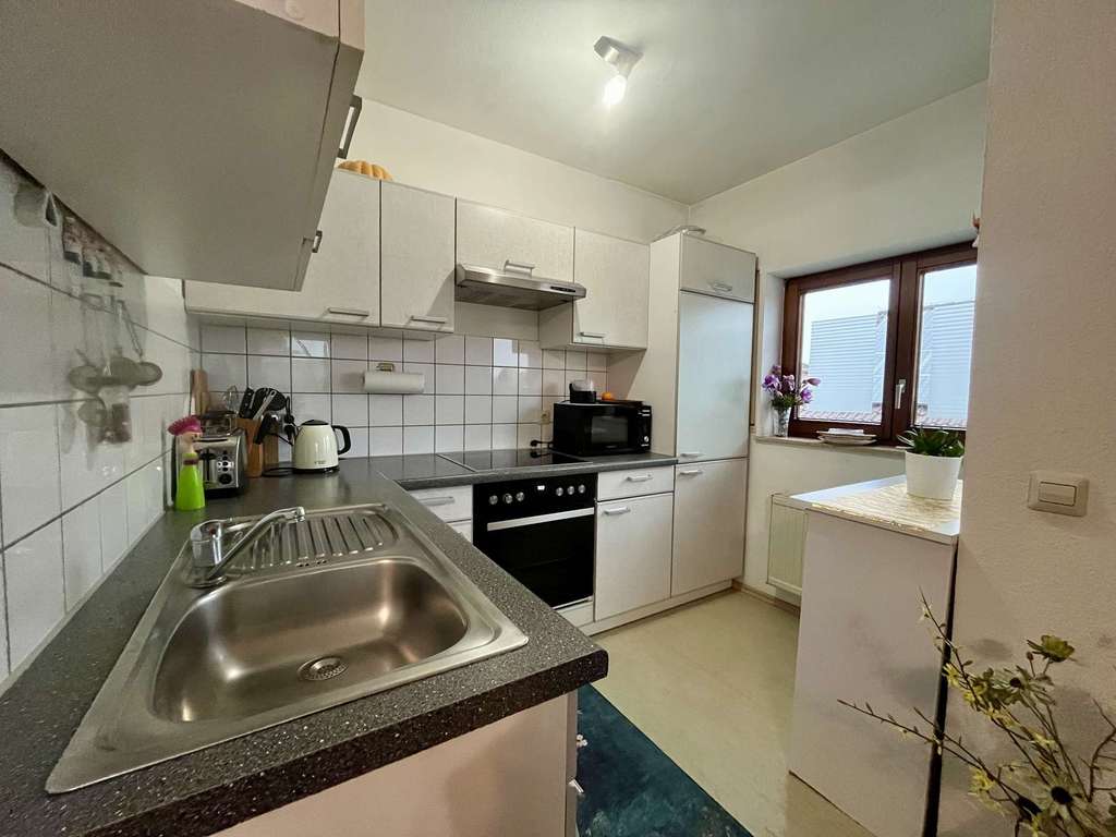 Immobilie in Göppingen - Attraktive 1-Zimmer-Wohnung als Kapitalanlage in Holzheim | Balkon & TG, nachhaltig vermietet - Bild 1