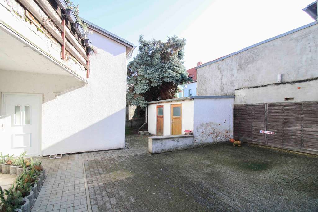 Immobilie in Staßfurt - Voll vermietetes 4-Parteienhaus mit Balkonen, Terrassen und Stellplätzen - Bild 4