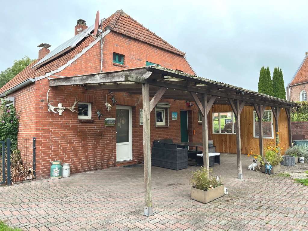 Immobilie in Ihlow - Gepflegtes Landhaus mit Nebengebäude in zentraler Wohnlage von Simonswolde - Bild 2