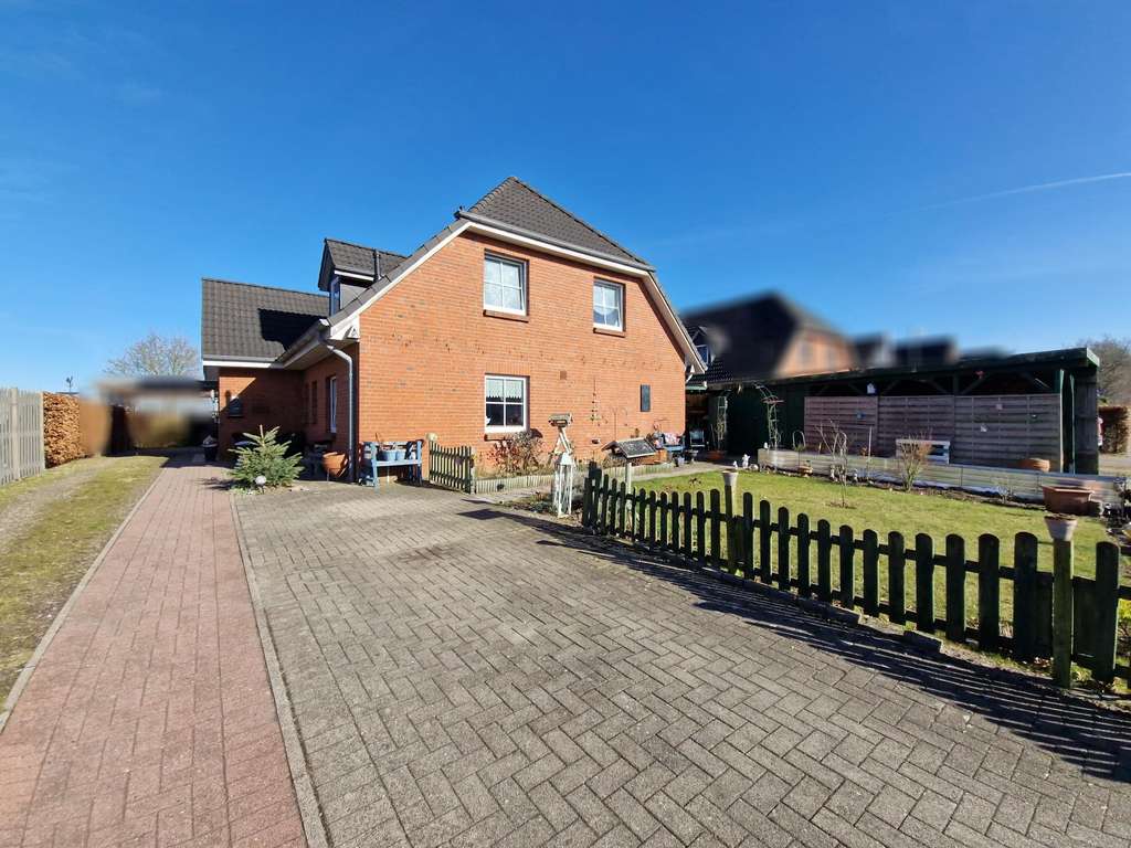 Immobilie in Jagel - Gepflegte sowie vermietete Doppelhaushälfte mit Carport und Terrasse in ruhiger Lage  - Bild 1