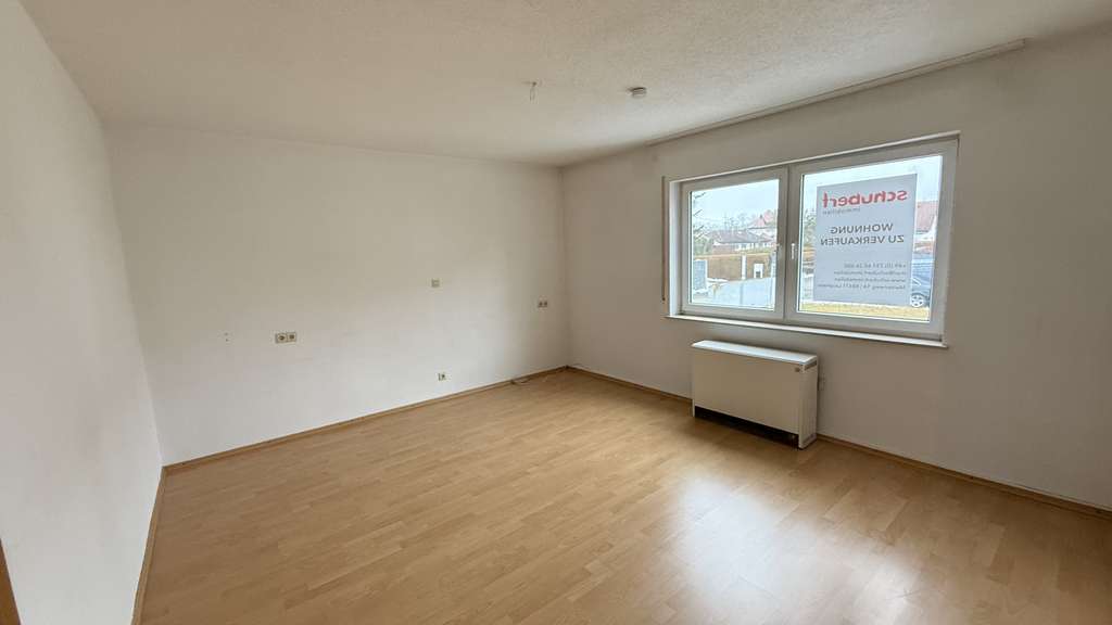 Immobilie in Vöhringen - Erdgeschosswohnung mit Terrasse, Gartenanteil & Garage – viel Potenzial in Vöhringen - Bild 2