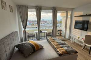 Stilvolle 1-Zimmer-Wohnung mit Balkon und faszinierendem Ausblick – Leopoldstraße 206, 80804 Neufreimann, München – Vorschaubild 1
