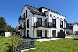 Neubau-Erstbezug: 3-Zi. EG-Wohnung mit privatem Garten und großzügiger Süd-West-Terrasse