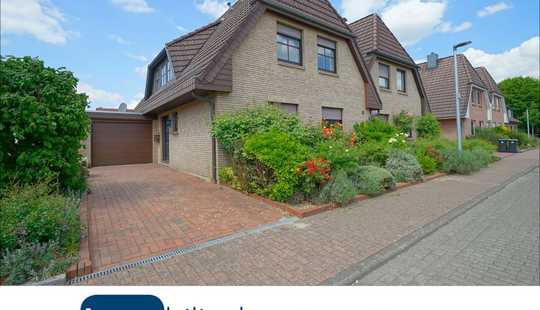 Bild von Doppelhaushälfte mit überdachter Terrasse und Garten sowie Garage