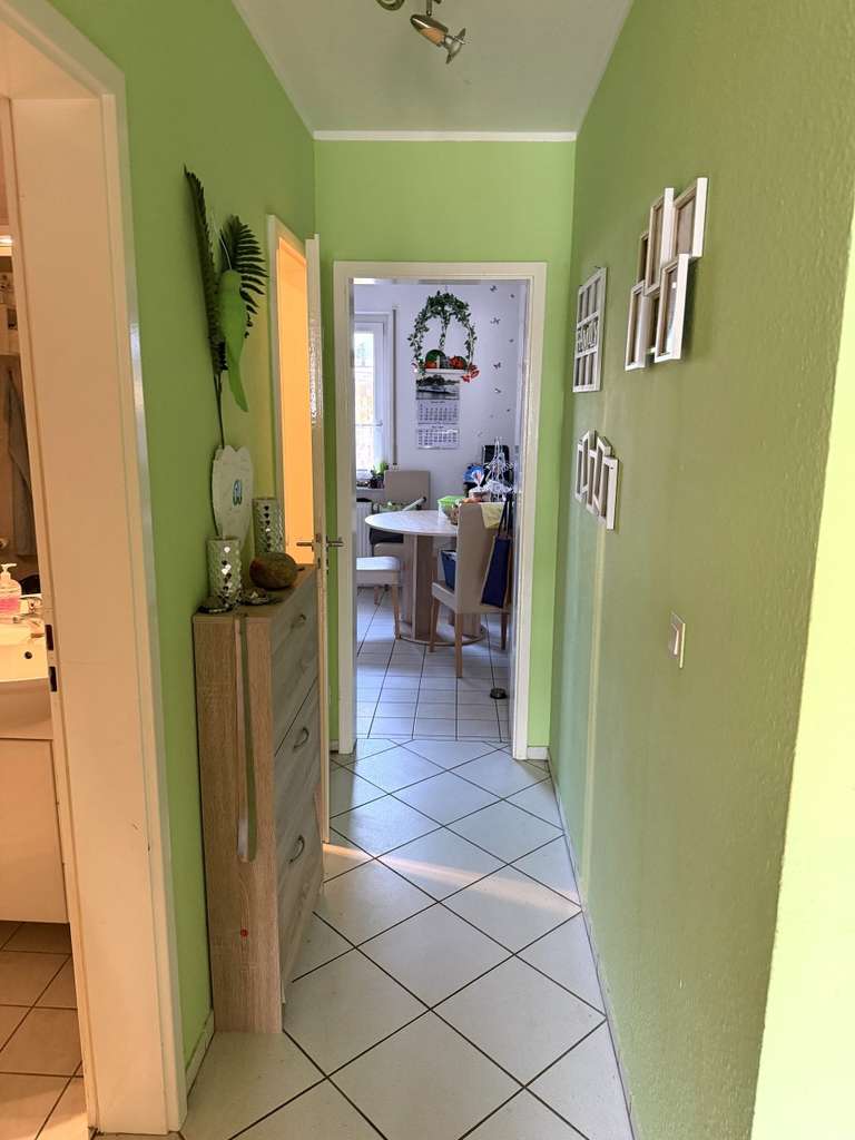 Immobilie in Elmenhorst - Gut vermietete 2- Zimmer Erdgeschosswohnung mit S- W Terrasse, eigenem Gartenanteil und Stellplatz - Bild 4