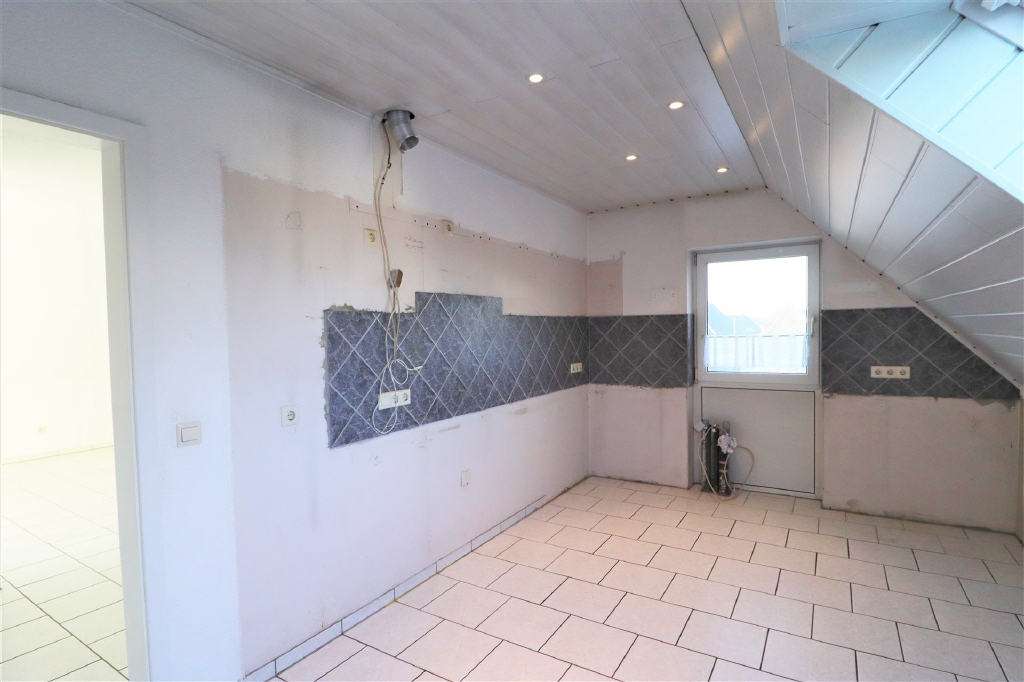 Immobilie in Rhede - Lichtdurchflutete Eigentumswohnung mit Ausbaupotenzial im Spitzboden in Rhede - Nord - Bild 1