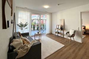 Erdgeschosswohnung mit beeindruckender Wohnfläche, Terrasse und elegantem Raumzuschnitt.