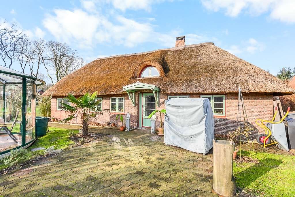 Immobilie in Süderlügum - Charmantes Reetdachhaus mit Ferienwohnung - Bild 1