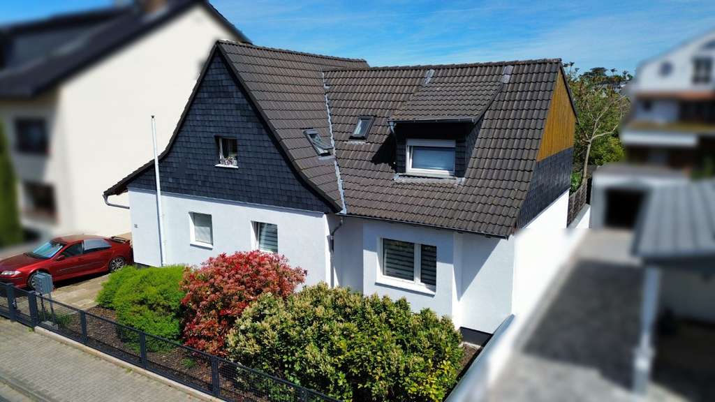 Immobilie in Kelsterbach - Vermietetes Mehrfamilienhaus mit Nebengebäude  Garten in zentraler Lage von Kelsterbach - Bild 4