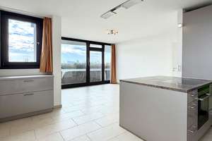 AIGNER - Weitblick über München: Ideal geschnittene 2-Zimmer-Wohnung mit Balkon - Erbbaurecht