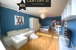 Stilvolles 1-Zimmer-Apartment mit Balkon, Ausblick ins Grüne und Citylage – komplett möbliert