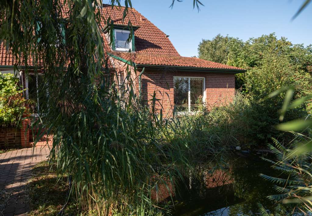 Immobilie in Grasberg - Einfamilienhaus mit Einliegerwohnung 
in idyllischer Lage - Bild 1