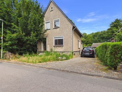 Bergheim-Rheidt, kleines sanierungsbedürftiges Einfamilienhaus auf großem Grundstück in ruhiger Lage