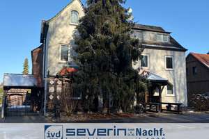 Traumhaftes Einfamilienhaus mit angebautem Mehrfamilienhaus und Mehrfachgaragen