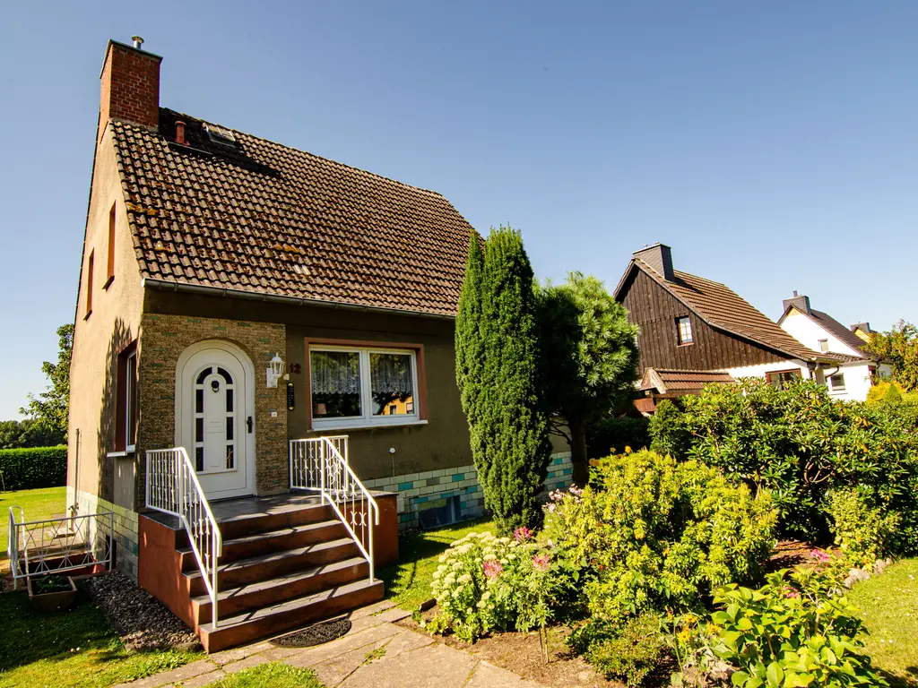 Großzügiges Einfamilienhaus mit gepflegtem Garten zu verkaufen - ideal für die ganze Familie!