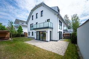 AIGNER - Neuwertige Doppelhaushälfte mit großzügigem Garten und viel Wohnkomfort