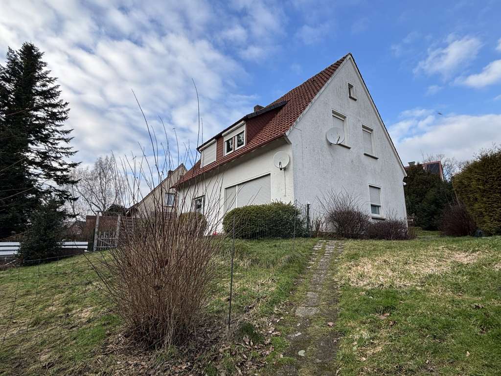 Immobilie in Ostercappeln - Einfamilienhaus mit großem Grundstück, 2 Garagen und viel Potenzial - Bild 3