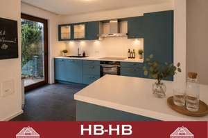 Viel Raum zum Leben: renovierte Maisonette-Wohnung mit Garten und Garage in begehrter Lage