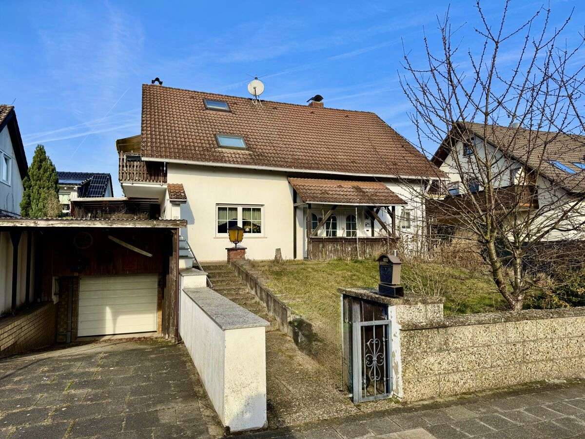Freistehendes Einfamilienhaus mit Einliegerwohnung, Garage & großer Terrasse, Darmstadt Dieburg Kreis – Bild 1