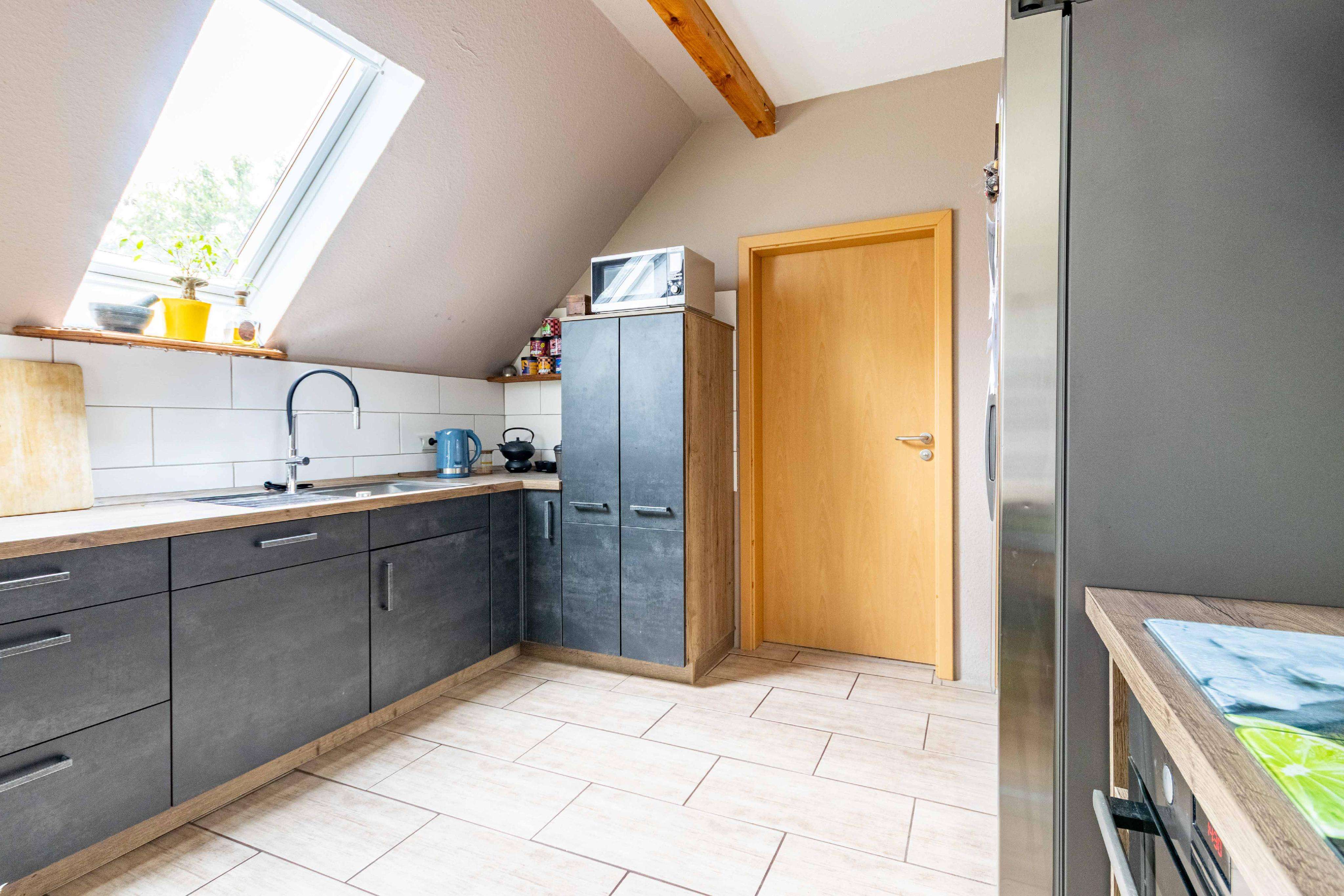 Immobilie in Ihlow - Fehnhaus-Hälfte in ruhiger Lage mit Garten und Ausbaupotenzial - Bild 0