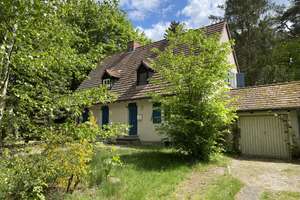 Charmante Doppelhaushälfte mit Garage und viel Gestaltungspotential vis-à-vis der Krummen Lanke