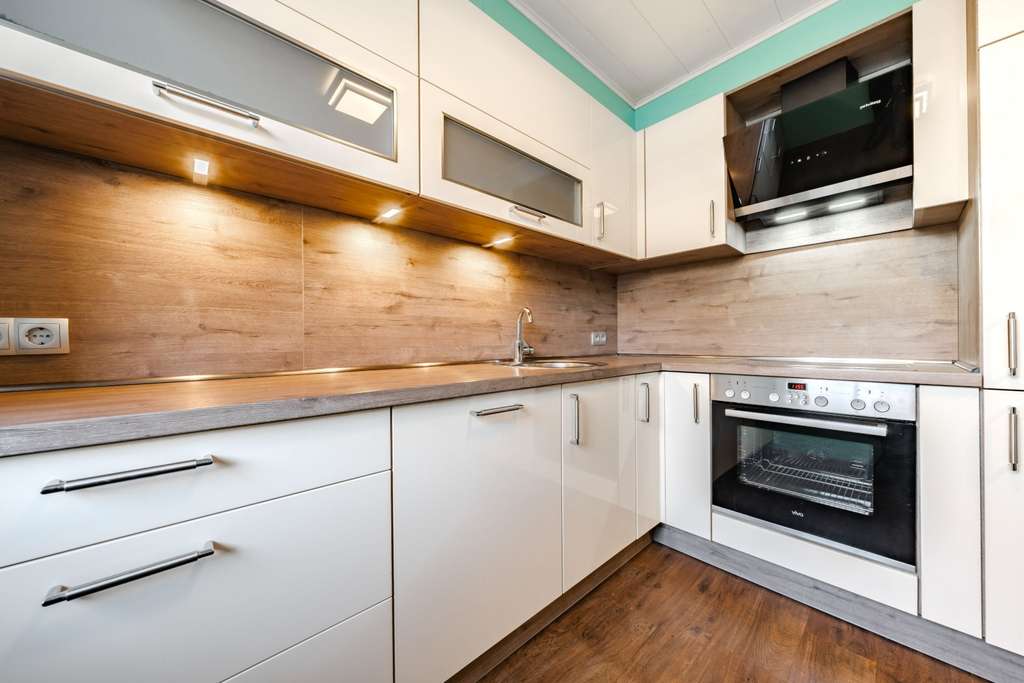 Immobilie in Westoverledingen - Charmantes Reihenmittelhaus mit Sommergarten, Studio im Spitzboden und Terrasse - Bild 1