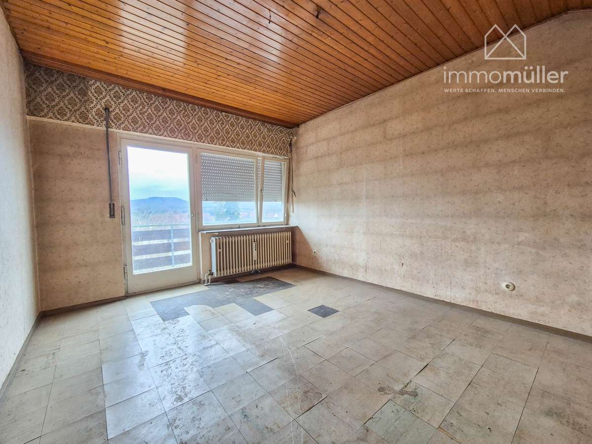 Immobilie in Eisenberg (Pfalz) - Split-Level-Reihenendhaus mit Garten & Garage in ruhiger Lage – großes Potenzial für Ihr Traumhaus! - Bild 0