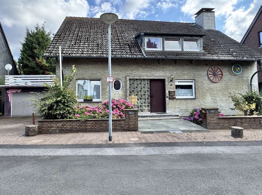 Immobilie in Rheinberg - freisteh. EFH mit Einliegerwohnung und Doppelgarage - Bild 0