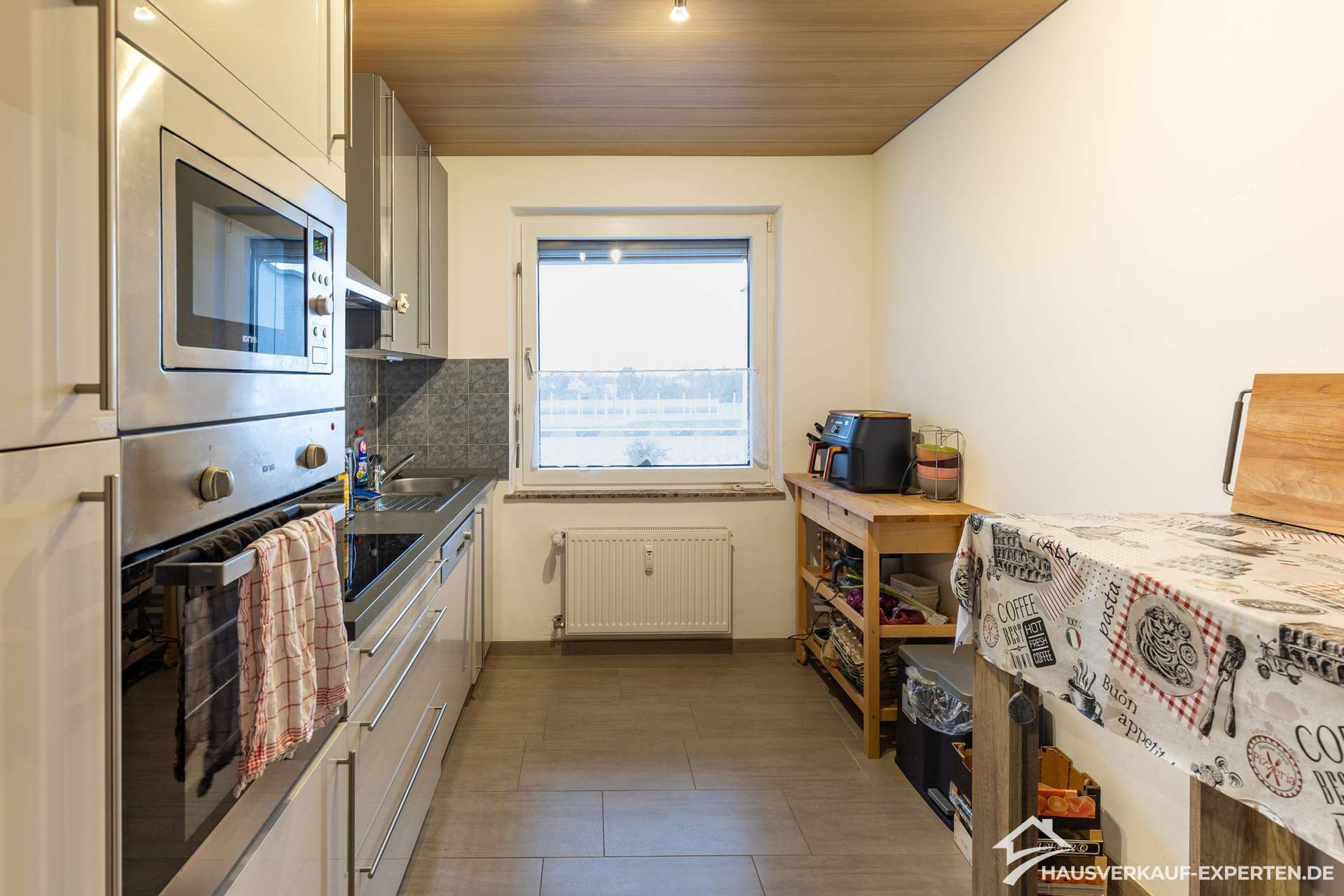 Immobilie in Voerde (Niederrhein) - Helle Räume, grüne Weite – Stilvolle Eigentumswohnung mit Balkon und Garage - Bild 0