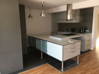 Traumhafte Dachgeschosswohnung mit Studio, Kamin, Dachterrasse und TG-Stellplatz
