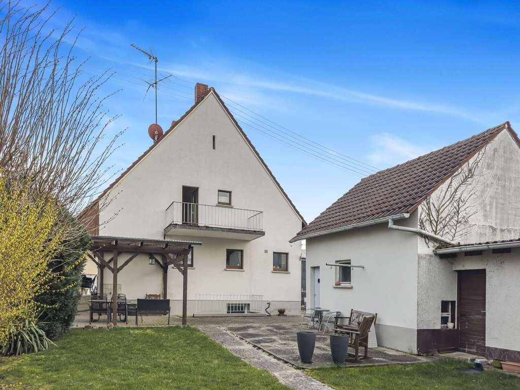 Immobilie in Lustadt - Solides Einfamilienhaus mit Garten, großer Garage und Entwicklungspotenzial - Bild 2