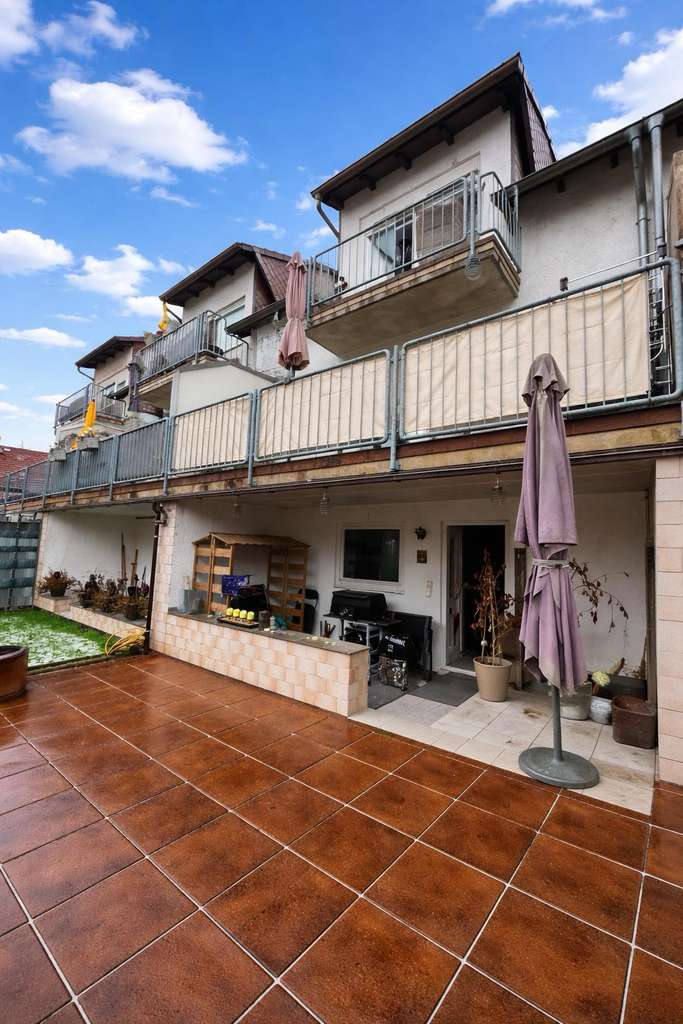 Immobilie in Kirchheim an der Weinstraße - Gepflegtes Reihenmittelhaus mit Garage in Feldrandlage - Bild 1