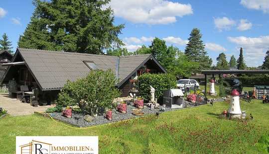 Bild von Urgemütliches Holzblockhaus auf idyllischem Grundstück im Ferienhausgebiet