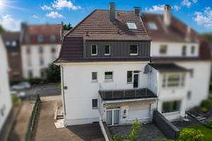 Attraktives Dreifamilienhaus mit drei Wohneinheiten und großem Grundstück nahe der Trasse
