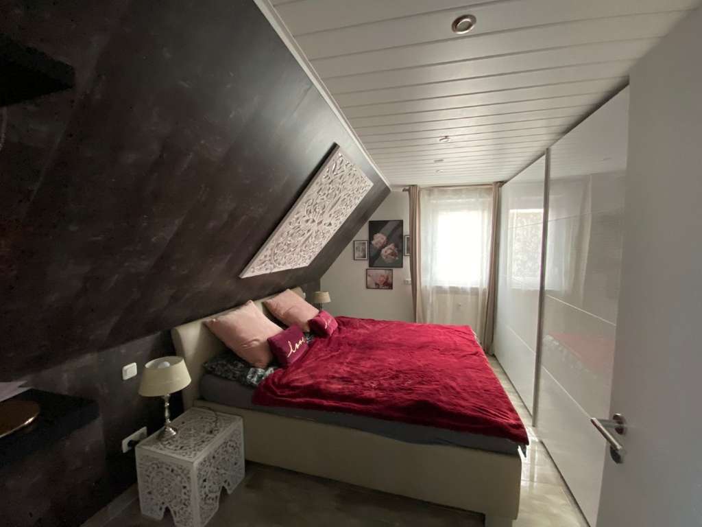 Immobilie in Raunheim - Gepflegtes Mehrfamilienhaus mit integrierter Gewerbefläche und weiterem Entwicklungspotenzial - Bild 3