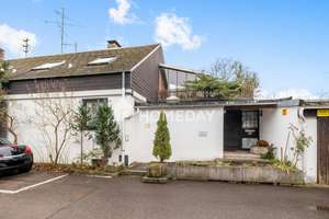 Großzügiges Einfamilienhaus mit Einliegerwohnung und gut vermieteter Gewerbeeinheit!