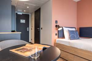 Furnished micro apartments, community areas, coworking & gym close to BMW