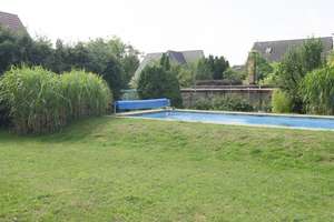 Wohnen mit Urlaubsflair – Modernisiertes Einfamilienhaus mit Gästehaus, Swimmingpool und traumhaftem – Straße 58 2, 13125 Karow, Berlin – Vorschaubild 5