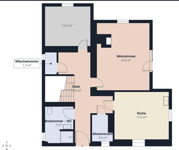 Grundriss des Erdgeschosses mit Wohnzimmer, Küche und Badezimmer.