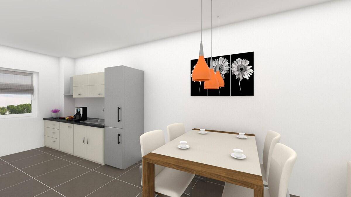 Moderne Küche mit hellen Schränken, dunkler Arbeitsplatte und Essbereich für vier Personen.