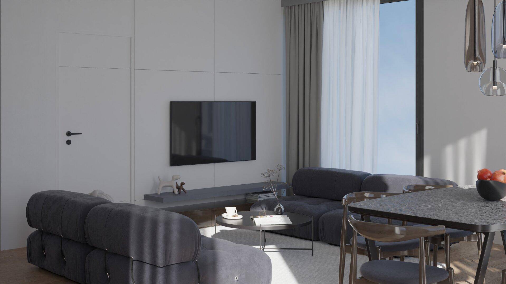 Heller Wohnbereich mit modernem Sofa, Fernseher und minimalistischer Einrichtung.