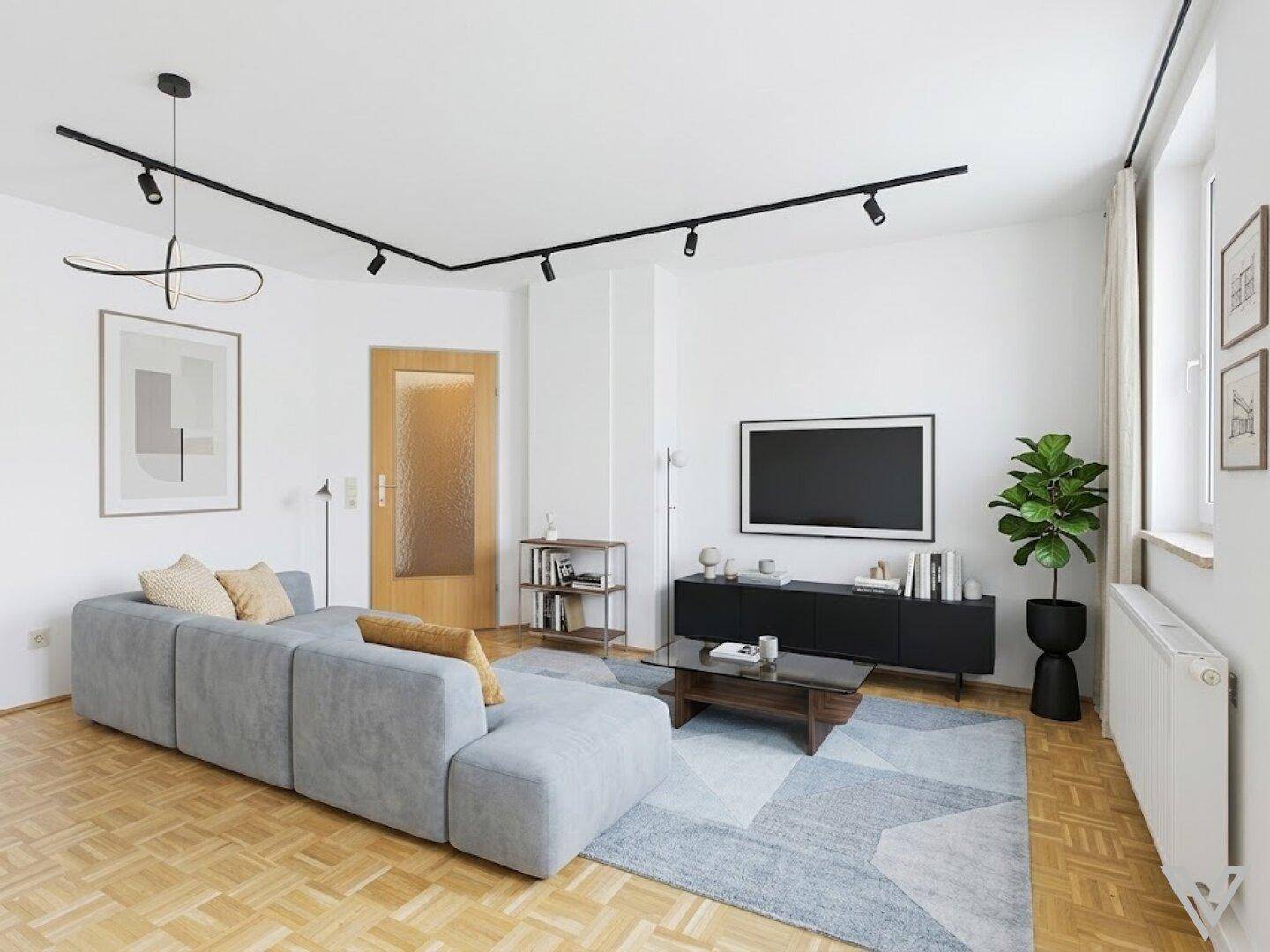 Helles Wohnzimmer mit modernem Design, Parkettboden und stilvoller Einrichtung.