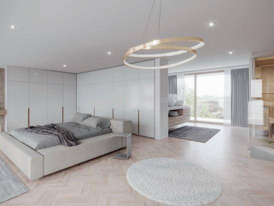 Helles Schlafzimmer mit modernem Design, integriertem Badbereich, Einbauschränken und großen Fenstern.