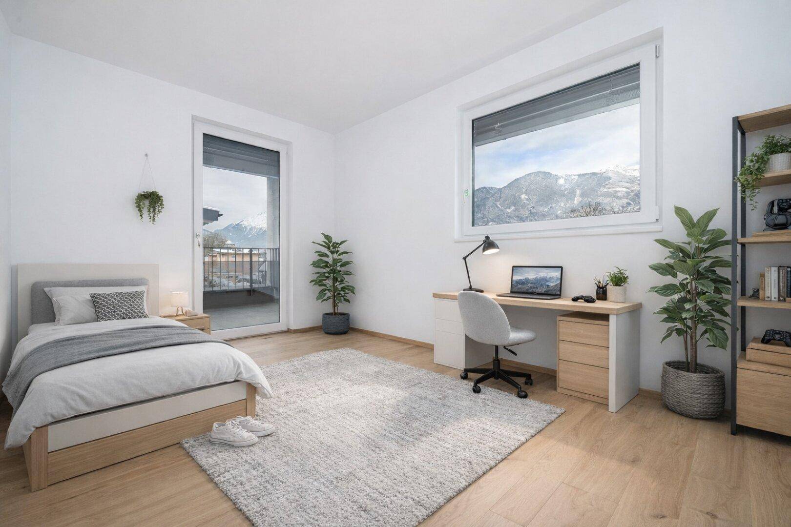 Helles Schlafzimmer mit Einzelbett, Schreibtisch, Parkettboden und Bergblick durch das Fenster.