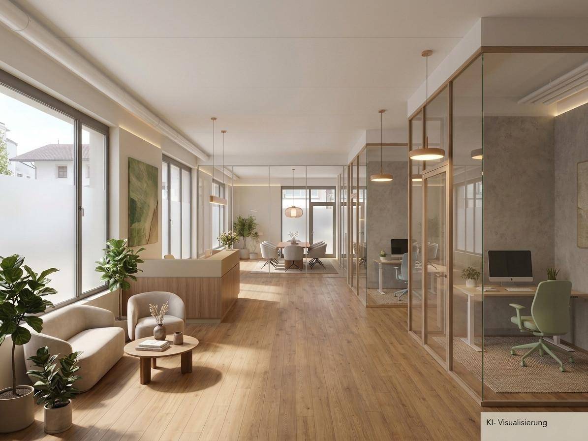 Modernes Büro mit Empfangsbereich, Lounge-Sitzgelegenheiten und durch Glaswände abgetrennten Arbeitsplätzen.