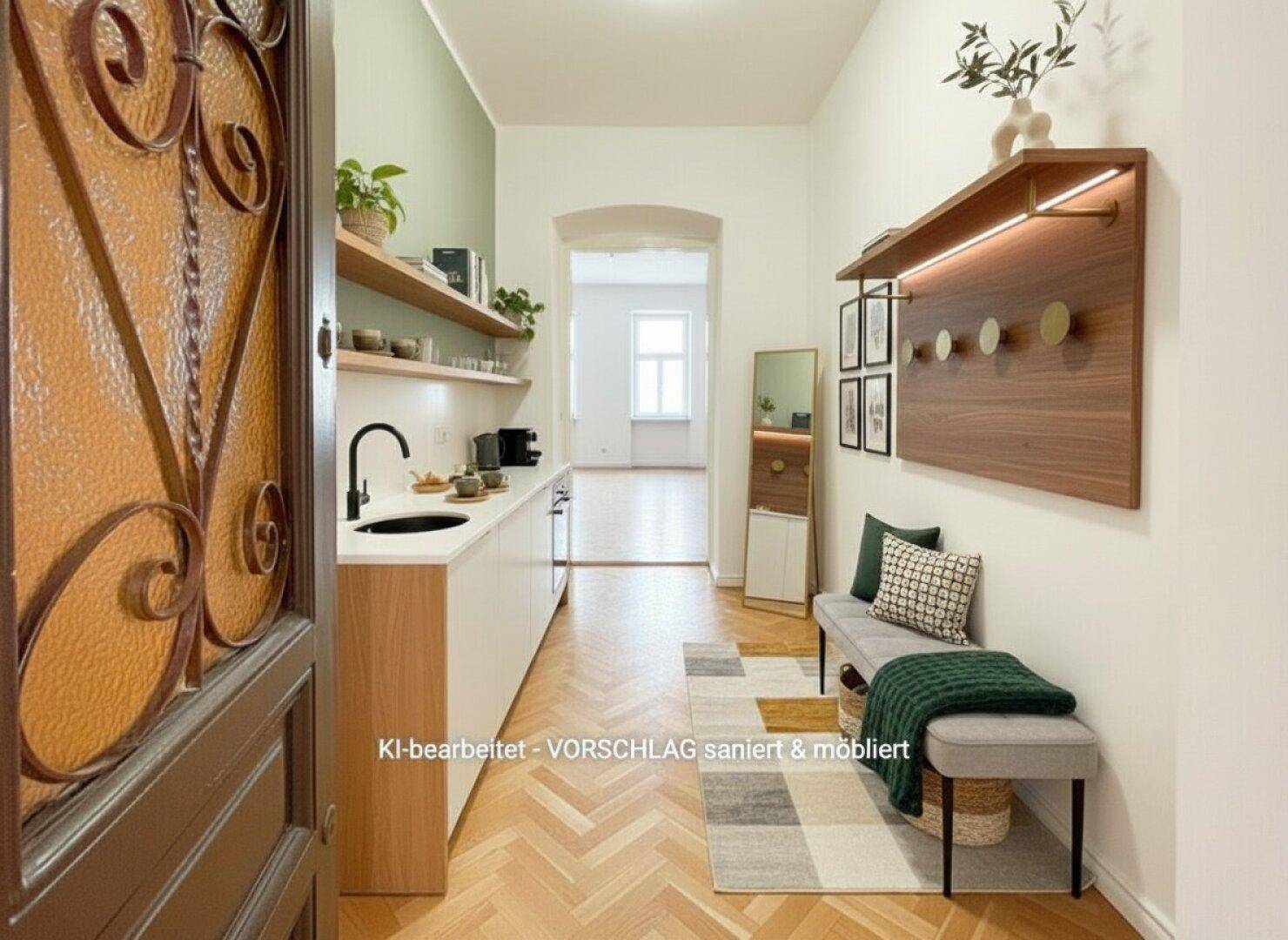 Eingangsbereich mit integrierter Küchenzeile, Garderobe und Fischgrätparkett.
