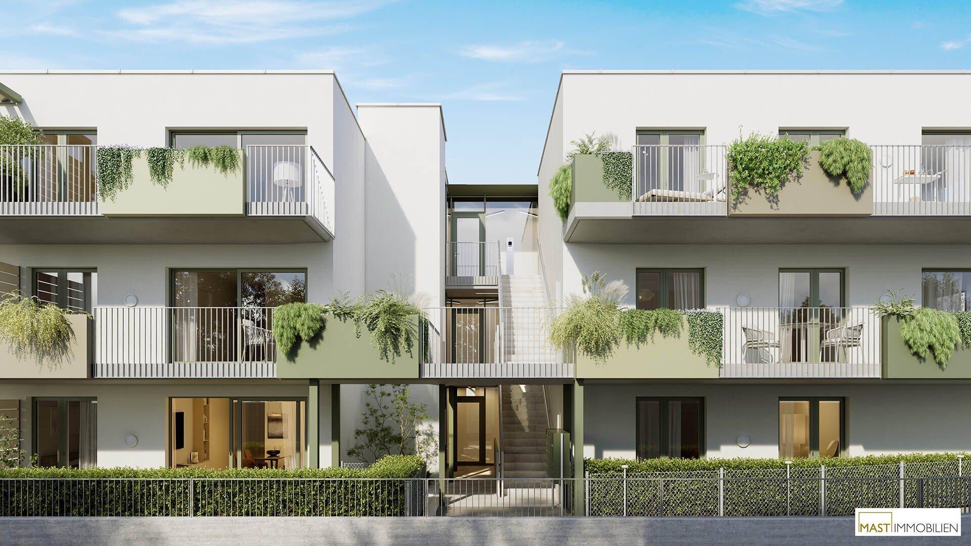 Moderne Wohnanlage mit weißer Fassade und begrünten Balkonen.