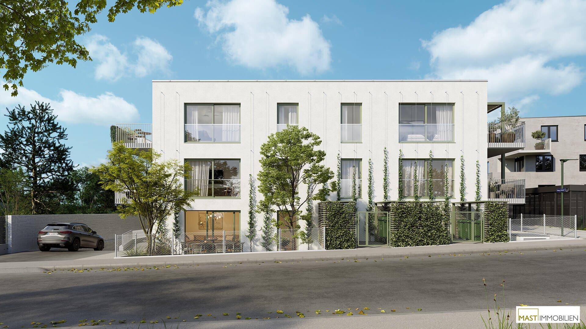 Straßenansicht der modernen Wohnanlage mit großen Fenstern und begrünten Fassadenelementen.