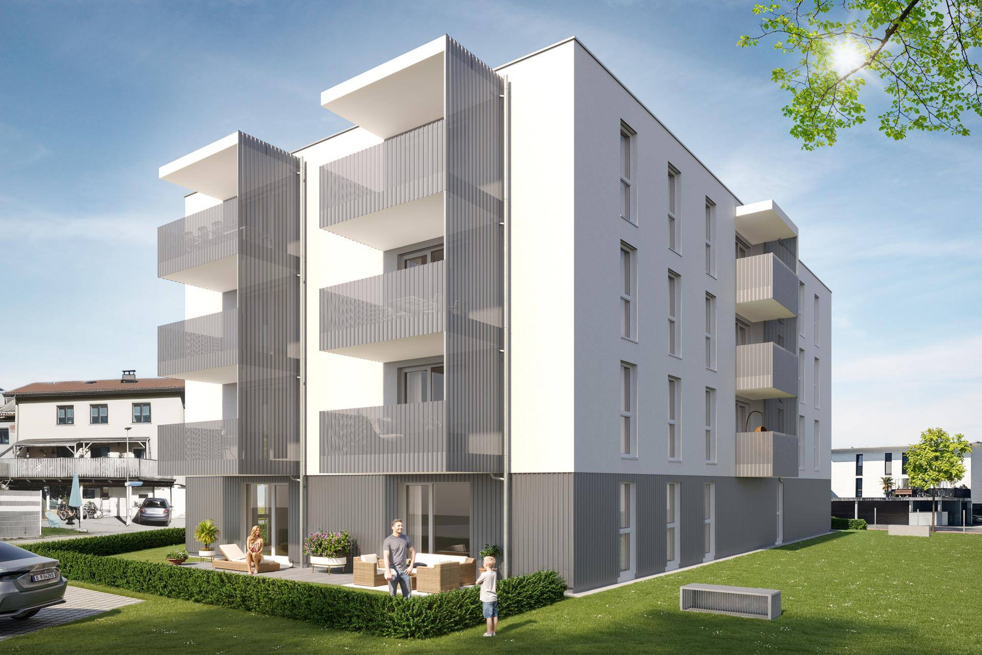 Moderne Wohnanlage mit Balkonen und einer ansprechenden Fassade in grüner Umgebung.